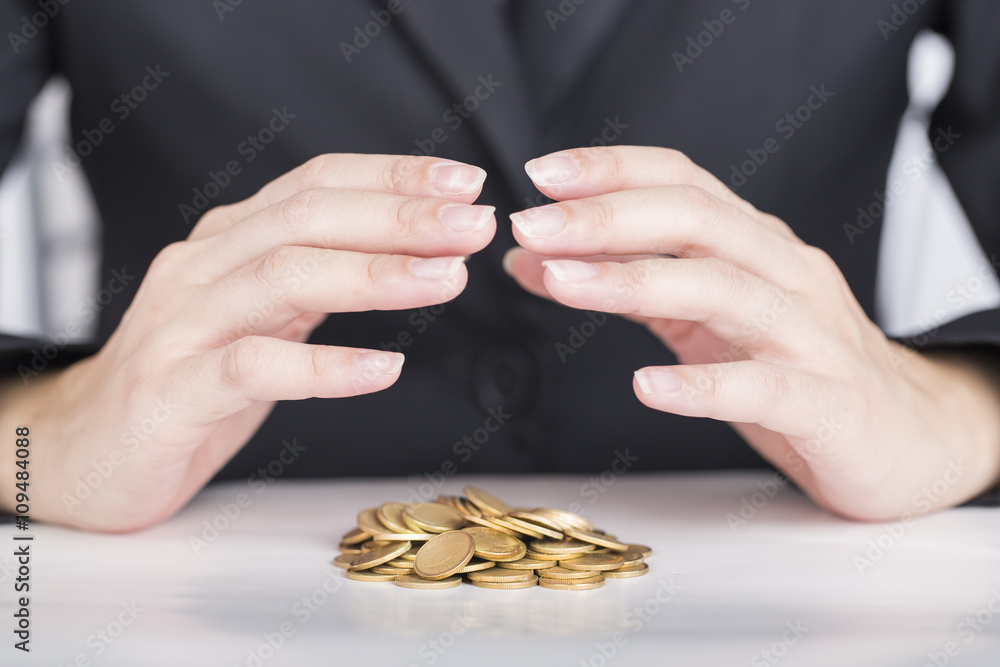 Fototapeta premium Close up business hands save money to stack of coins.