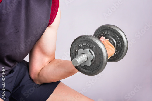 Man hand training lifting dumbbell strong bodybuilding.