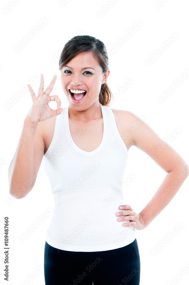 Happy Young Fitness Woman Giving OK gesture Happy Young Fitness Woman Giving OK gesture
