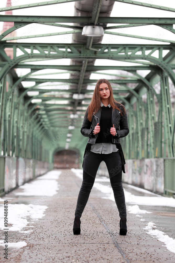 Obraz premium Beautiful girl in black leather jacket in winter time