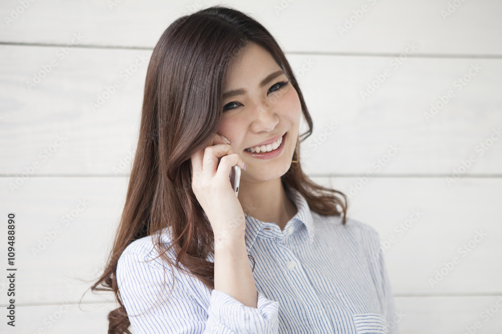 Beautiful woman is talking on smartphone Beautiful woman is talking on smartphone