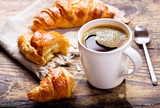cup of coffee with croissants