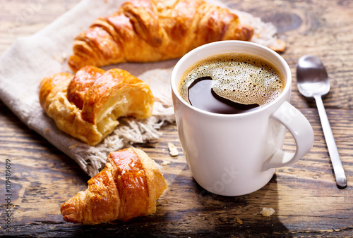cup of coffee with croissants