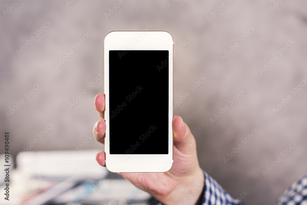 Hand with blank smartphone
