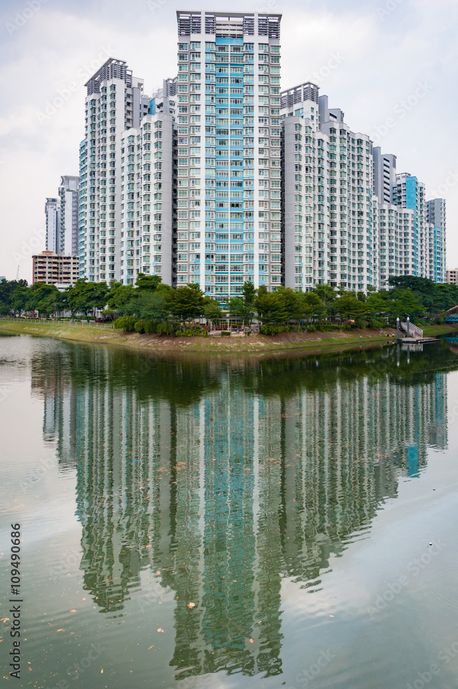 typical Singapore highrise public housing estate beside river.