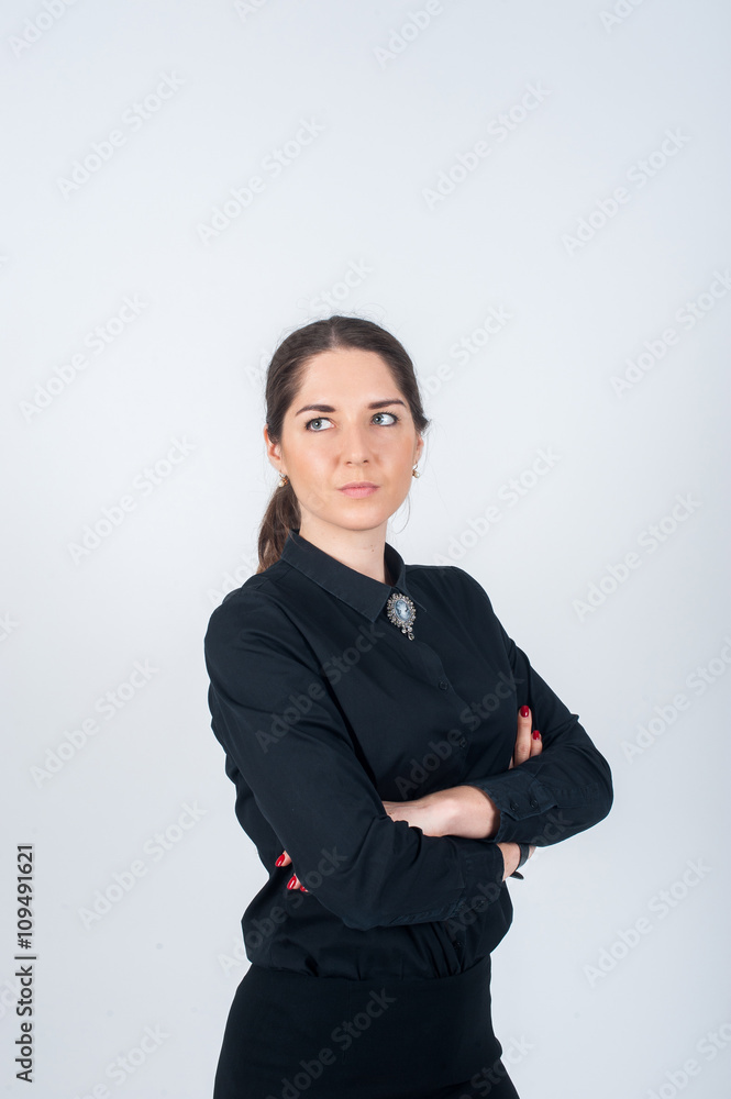 Business woman standing sideways simply in black shirt Business woman standing sideways simply in black shirt