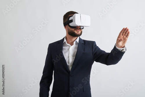 Close up of businessman in virtual reality glasses