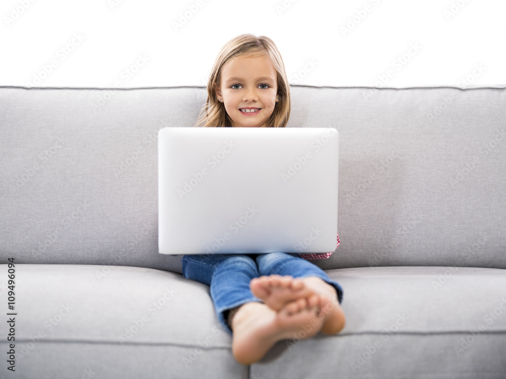 Little girl working with a laptop Little girl working with a laptop