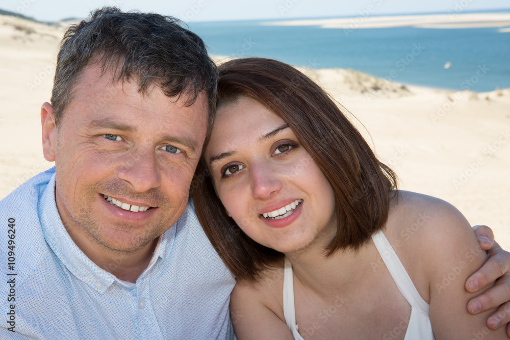 Lovely and happy romantic couple on the beach Lovely and happy romantic couple on the beach