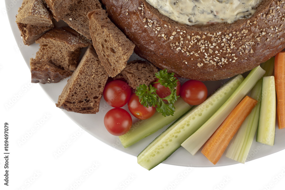 pumpernickel bread with spinach dip, vegetables slices and bread cubes