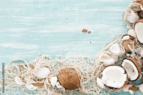 summer background with fishing net and coconuts.