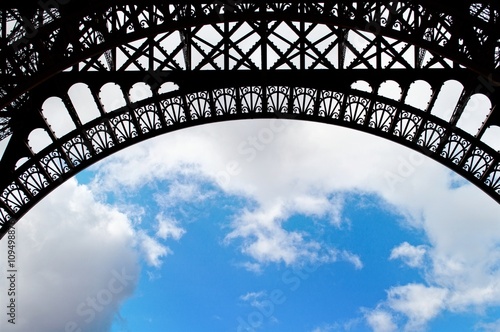Close-up view on an arch of the Eiffel tower © photo_fact
