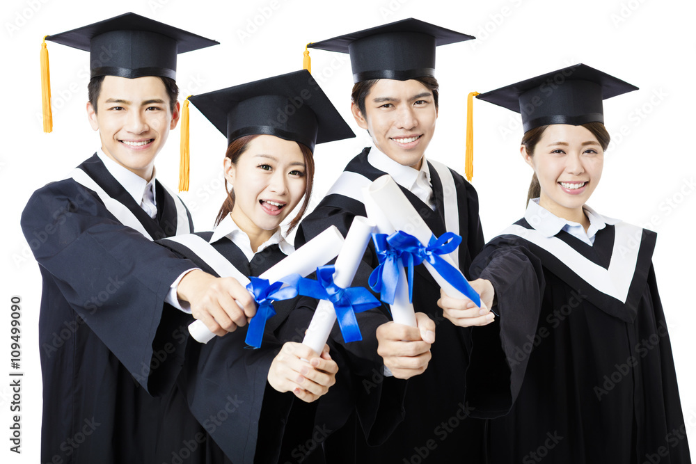 college graduates in graduation gowns standing and smiling college graduates in graduation gowns standing and smiling