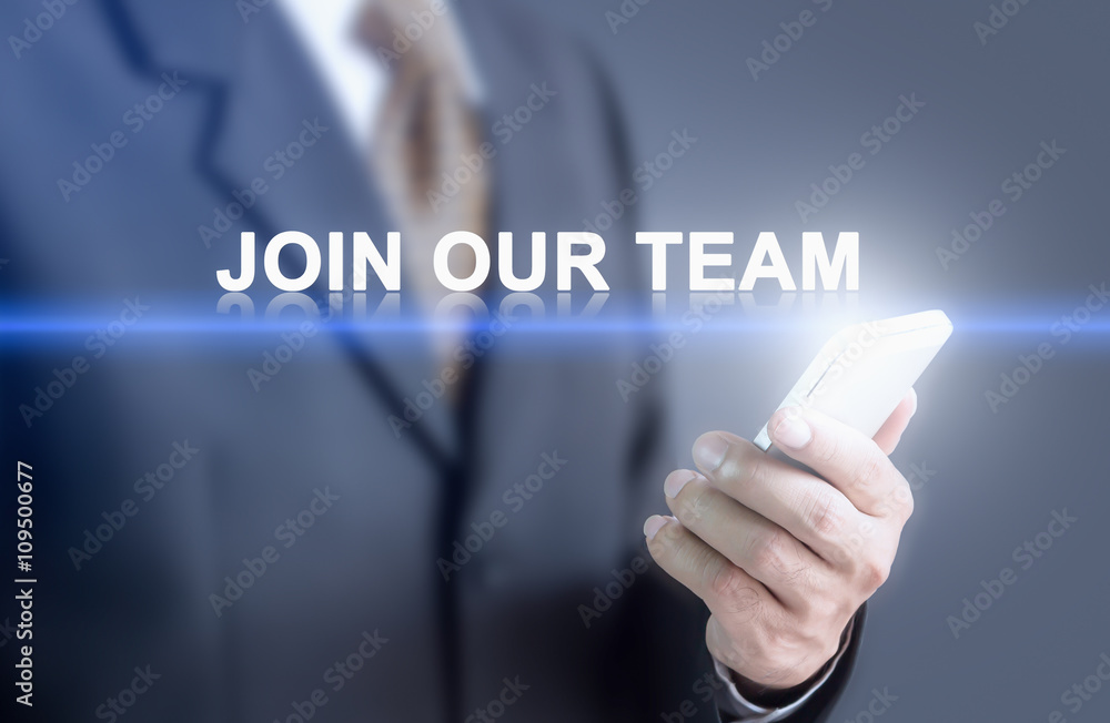 Businessman pressing hand Join our team message on virtual screen. Can bring to the medium of your ad. Businessman pressing hand Join our team message on virtual screen. Can bring to the medium of your ad.