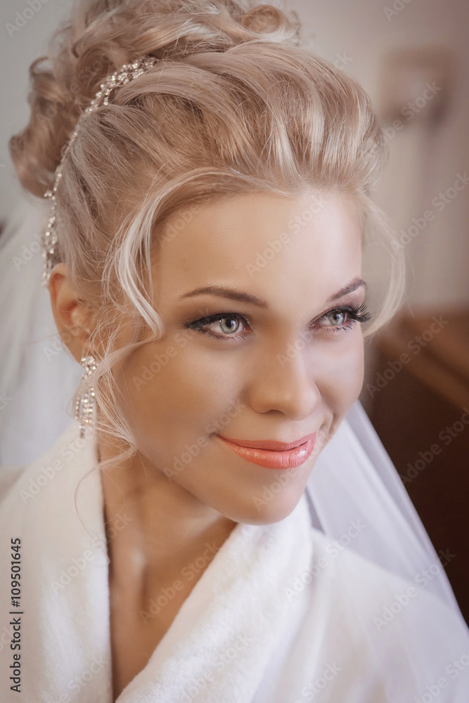 Beauty / Fashion / Hairstyle / Makeup photo shoot. / Wedding. Close-up portrait of beautiful blonde in white on white interior background Wedding makeup close up. Happy Wedding day Beauty / Fashion / Hairstyle / Makeup photo shoot. / Wedding. Close-up portrait of beautiful blonde in white on white interior background Wedding makeup close up. Happy Wedding day