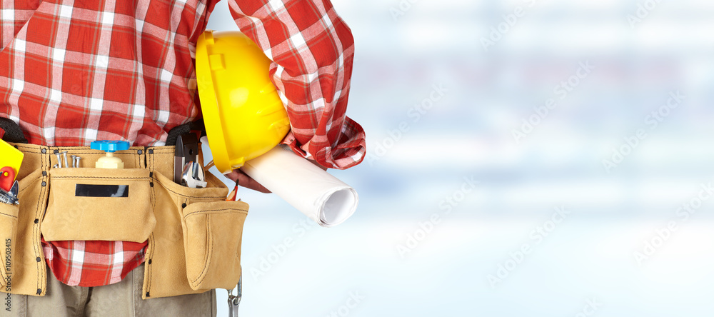 Construction worker with a tool belt. Construction worker with a tool belt.
