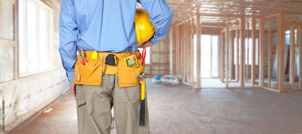 Construction worker with a tool belt. Construction worker with a tool belt.