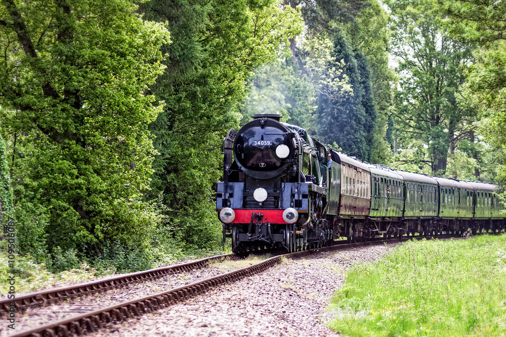 Fototapeta premium Rebuilt Bulleid Light Pacific No. 34059 steam locomotive near Kingscote Station
