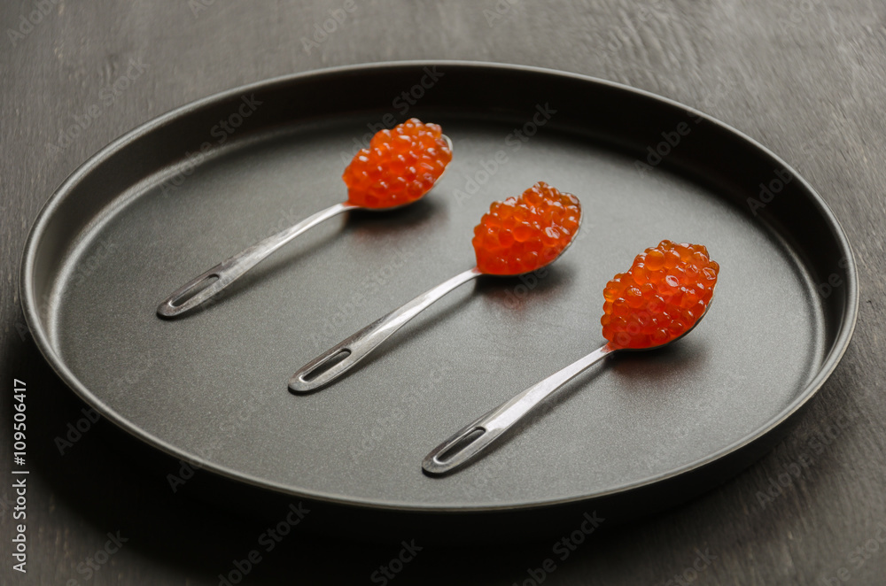 three spoons with red caviar three spoons with red caviar
