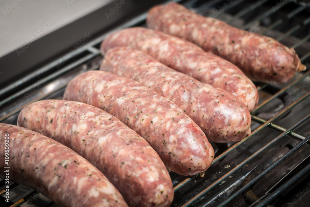 sausage cooking herbs on an electric bbq sausage cooking herbs on an electric bbq