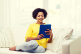 happy african american woman with tablet pc