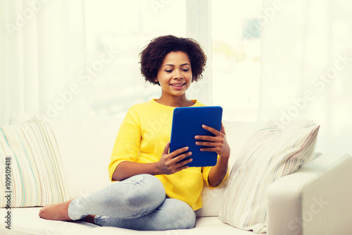 happy african american woman with tablet pc