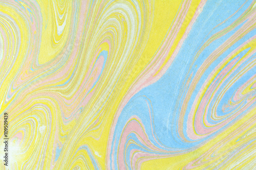 Ebru art. Traditional Turkish Ebru technique. Marbling painting on water transferred on highly textured paper or cloth. Color paint ebru with waves and tile pattern.