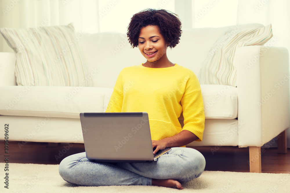 happy african american woman with laptop at home happy african american woman with laptop at home