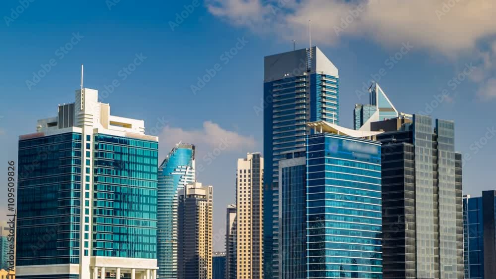 Scenic skyline of Dubai's business bay with skyscrapers at day time timelapse. Scenic skyline of Dubai's business bay with skyscrapers at day time timelapse.