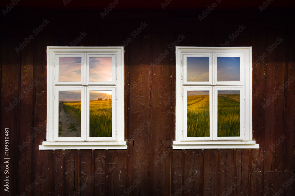 Sunset with a white wooden window Sunset with a white wooden window
