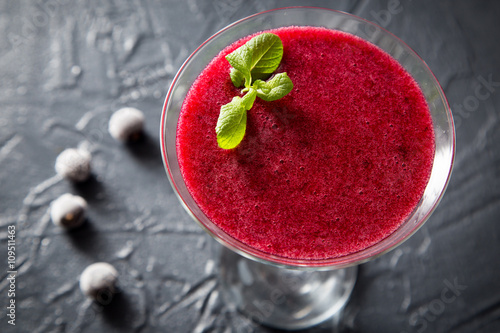 red smoothie with frozen berries, selective focus, top view. detox koncept