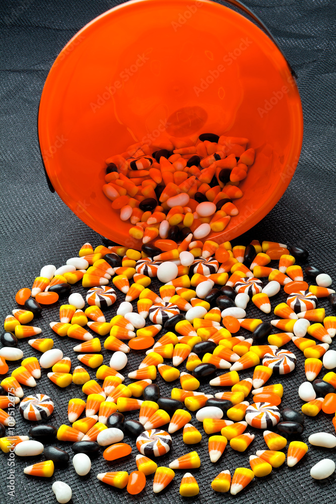 Fototapeta premium variety of candies spilled out of the basket.