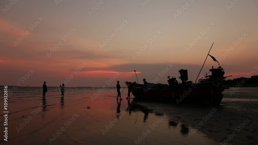 Beautiful silhouette fishing boat and Sunset over the sea. Bangpu Recreation Center (Samut Prakan, Thailand)