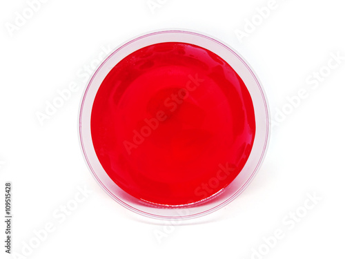 Canvas Print Red strawberry  jelly with fruit piece in a plastic cup