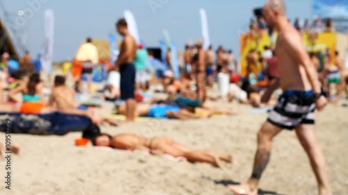 a lot of people are resting on the beach