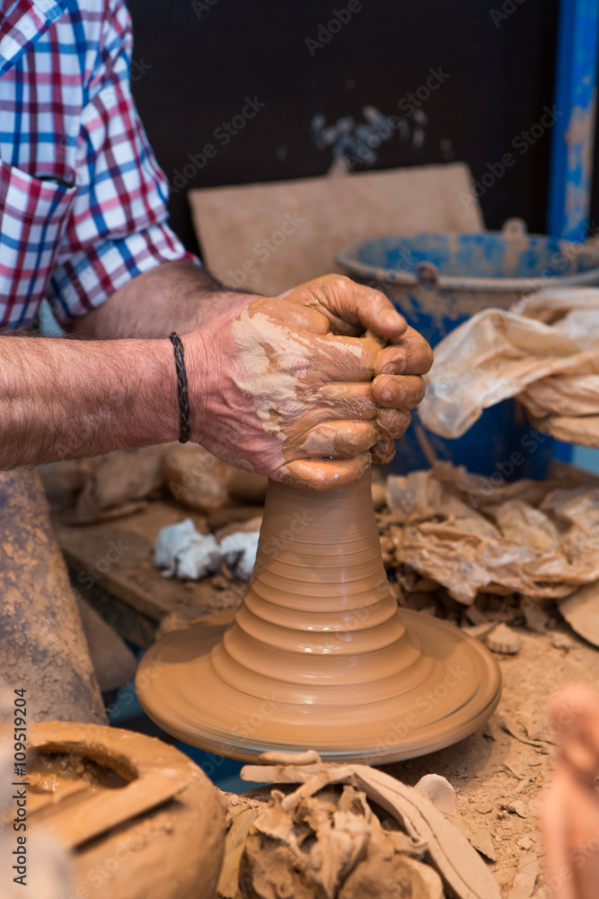 Hands of making clay pot on the pottery wheel, Cordoba, Andalusia, Spain