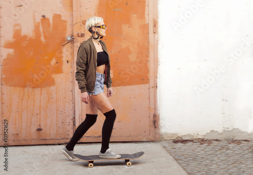 Young woman skateboarding © phoenix021