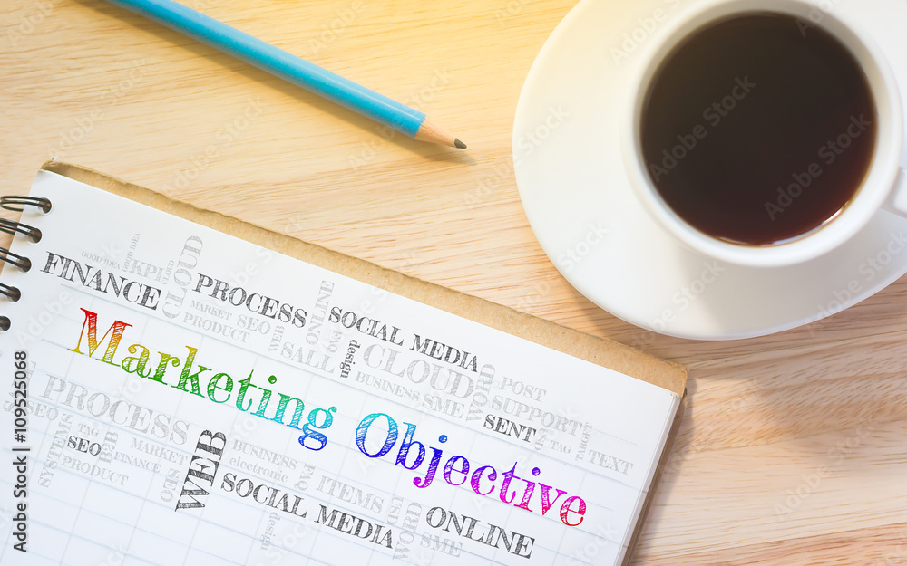 Concept Marketing Objective message on book. A pencil and a glass coffee table.Vintage tone. Concept Marketing Objective message on book. A pencil and a glass coffee table.Vintage tone.