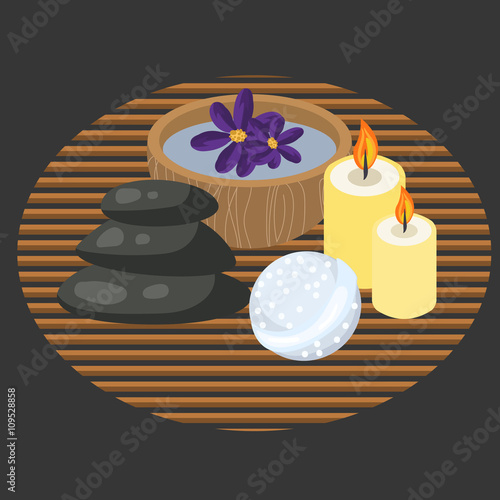 Spa procedure accessories on makisu mat. Spa massage pebbles, candles, bath bomb and aroma water in bowl.