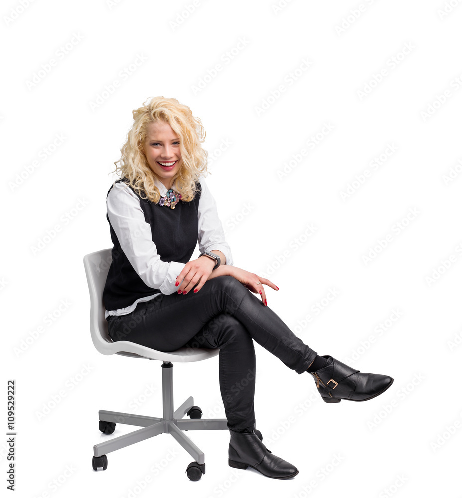 Beautiful woman sitting in chair and smiling Beautiful woman sitting in chair and smiling