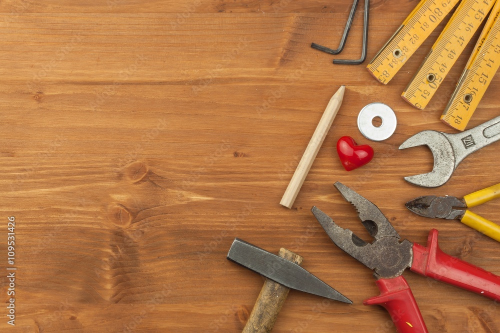 Set of tools and instruments on wooden background. Different kinds of tools for household chores. Home repairs. Father's Day.
Set of tools and instruments on wooden background. Different kinds of tools for household chores. Home repairs. Father's Day.