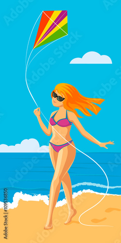 Girl with a kite on the beach