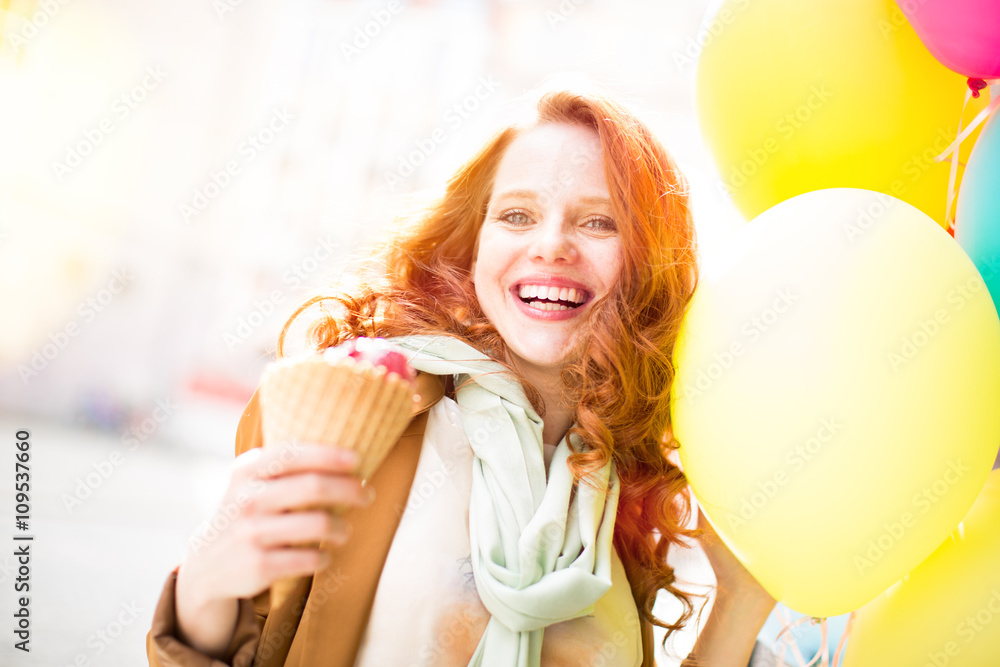 Beauty with red hair and ice cream