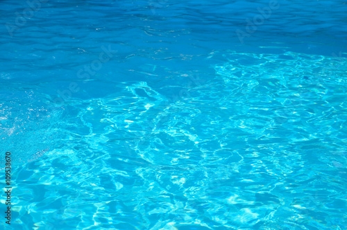 Blue and turquoise color of water under summer sun
