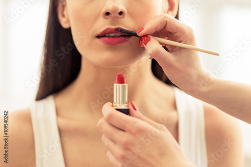 Beautiful girl doing makeup