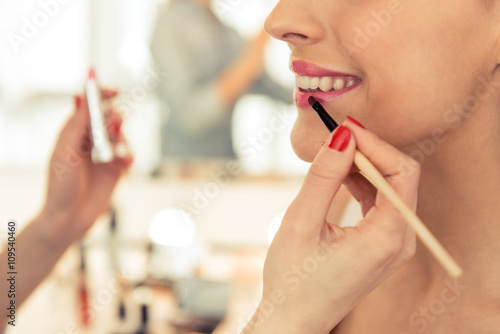 Beautiful girl doing makeup