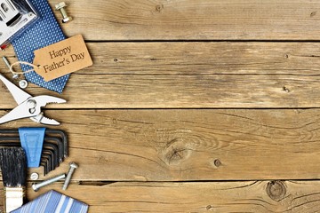 Happy Fathers Day gift tag with side border of tools and ties on a rustic wood background