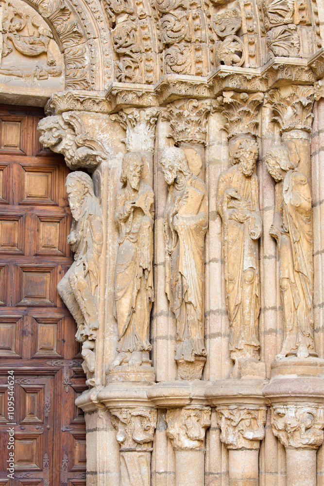 AVILA, SPAIN, APRIL - 19, 2016: The right part of romanesque west portal of Basilica de San Vicente with the apostles. (1130).