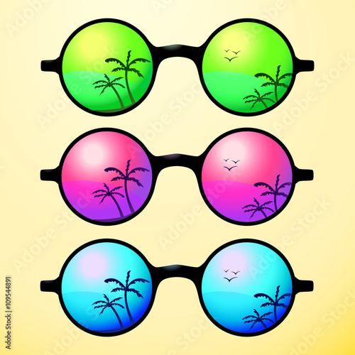 Trendy, round and vintage sunglasses with colorful lens reflect summer palms