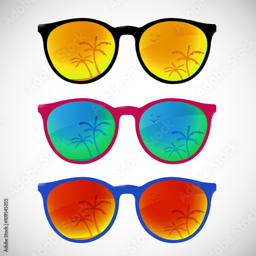 Trendy sunglasses with colorful lens and frame reflect summer palms